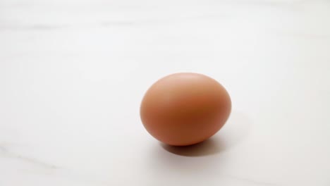 chicken eggs rotate on the kitchen table