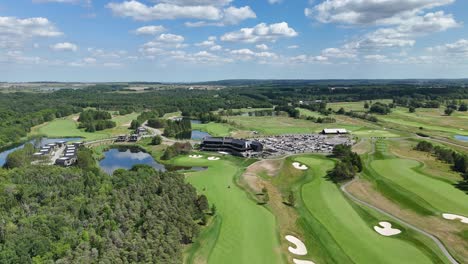 aerial: tpc toronto at osprey valley golf course during the day in alton, caledon, ontario, canada, orbit drone shot