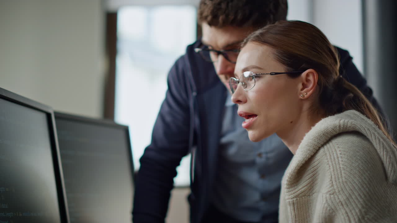 Software team consulting office closeup. It engineer supervisor teaching intern