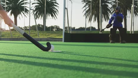 Female-hockey-players-playing-on-the-field