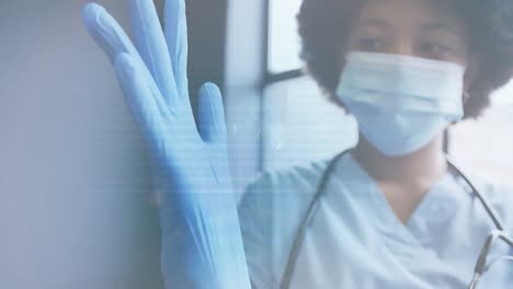 animation of scanner and data processing over female doctor in face mask putting on surgical gloves