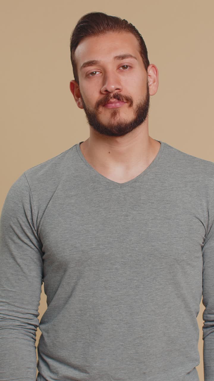 Tired serious upset lebanese man showing pause gesture stop sign time out relax break deadline