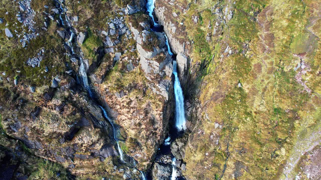 Irish mountains drone defending on cascades of flood water Mahon falls Comeragh Mountains Waterford Ireland