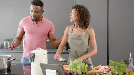 cooking together, couple preparing meal in modern kitchen with fresh vegetables