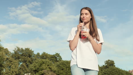 woman drinking soda on summer day