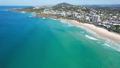 coolum bay with turquoise water in sunshine coast, queensland, australia - aerial drone shot