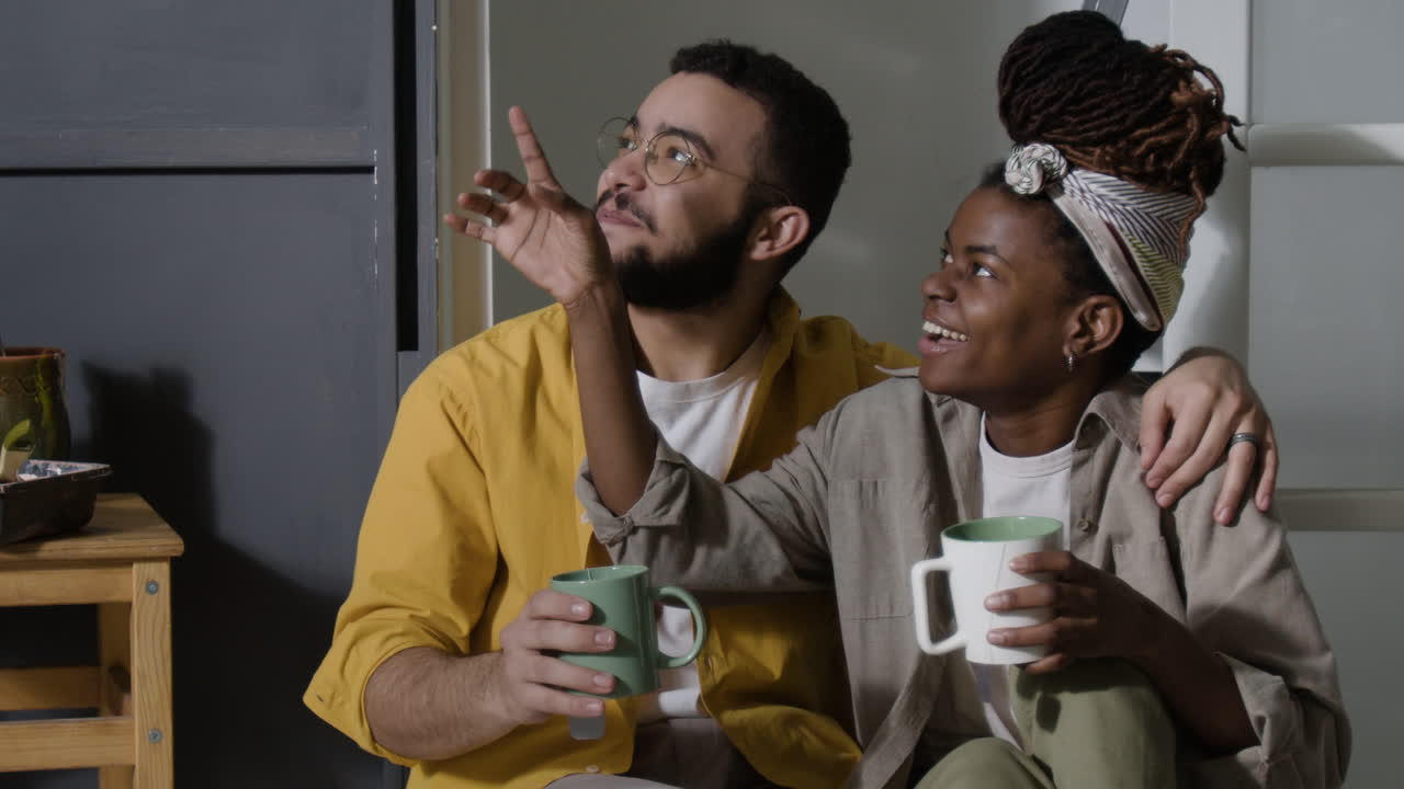 A loving couple enjoying coffee in their kitchen