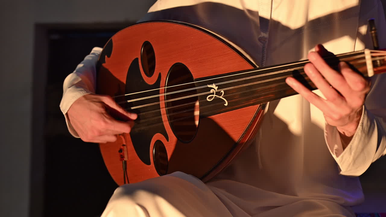 An Arab musician plays the oud, a beloved traditional string instrument in Arabic music