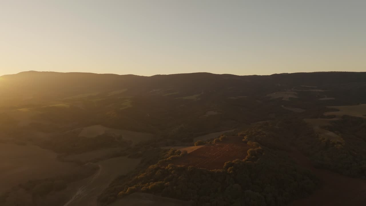 Aerial view of shimmering sunset, Greece golden hour above Souroti village - dolly forward