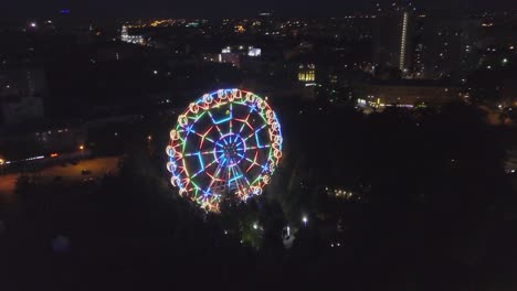 colorful ferris wheel at night in city park