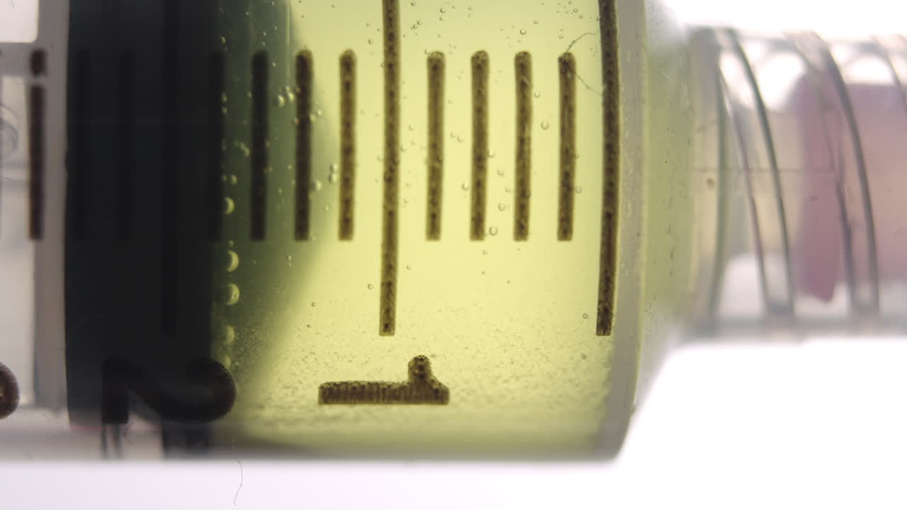 Close-up of a Syringe Filled with a Yellow Liquid
