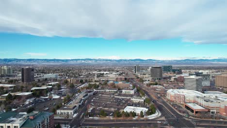 drone aerial view of denver, colorado suburb with busy highway traffic