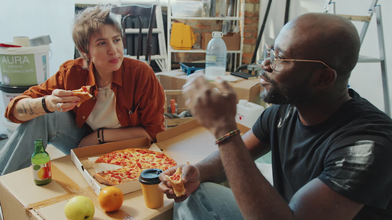 Man and Woman Chatting over Meal on Lunch Break during Home Renovation