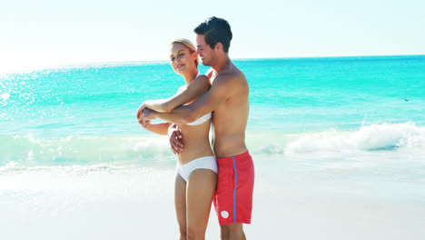 Couple-romancing-at-beach