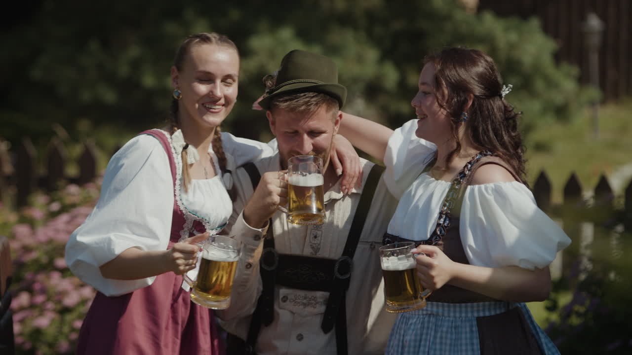 People in traditional clothing celebrating with beer