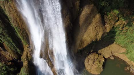 a nice close up drone shot of the waterfalls of thi lo su waterfall, located off the beaten track in the backpacker's paradise of north thailand in the area of umphang in asia