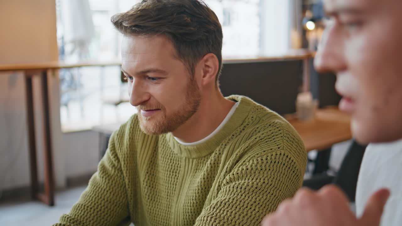 Designers team videocalling computer at office closeup. Colleagues brainstorming