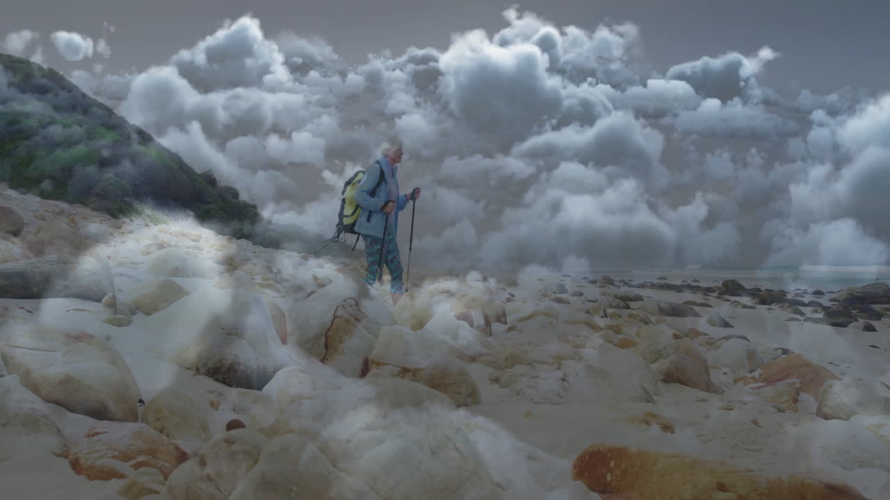 Woman hiking along rocky beach with backpack for health, using animated heart icons and data chart