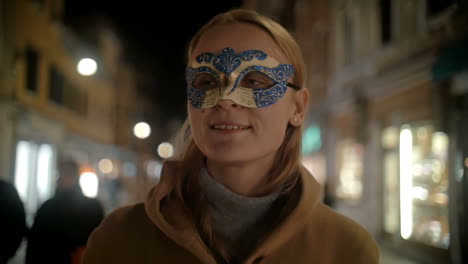 woman in carnival mask walking in venice italy