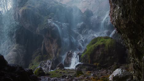 waterfall falling over the rock on slow motion with moving forward