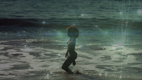 animación de puntos de luz sobre mujer afroamericana en la playa