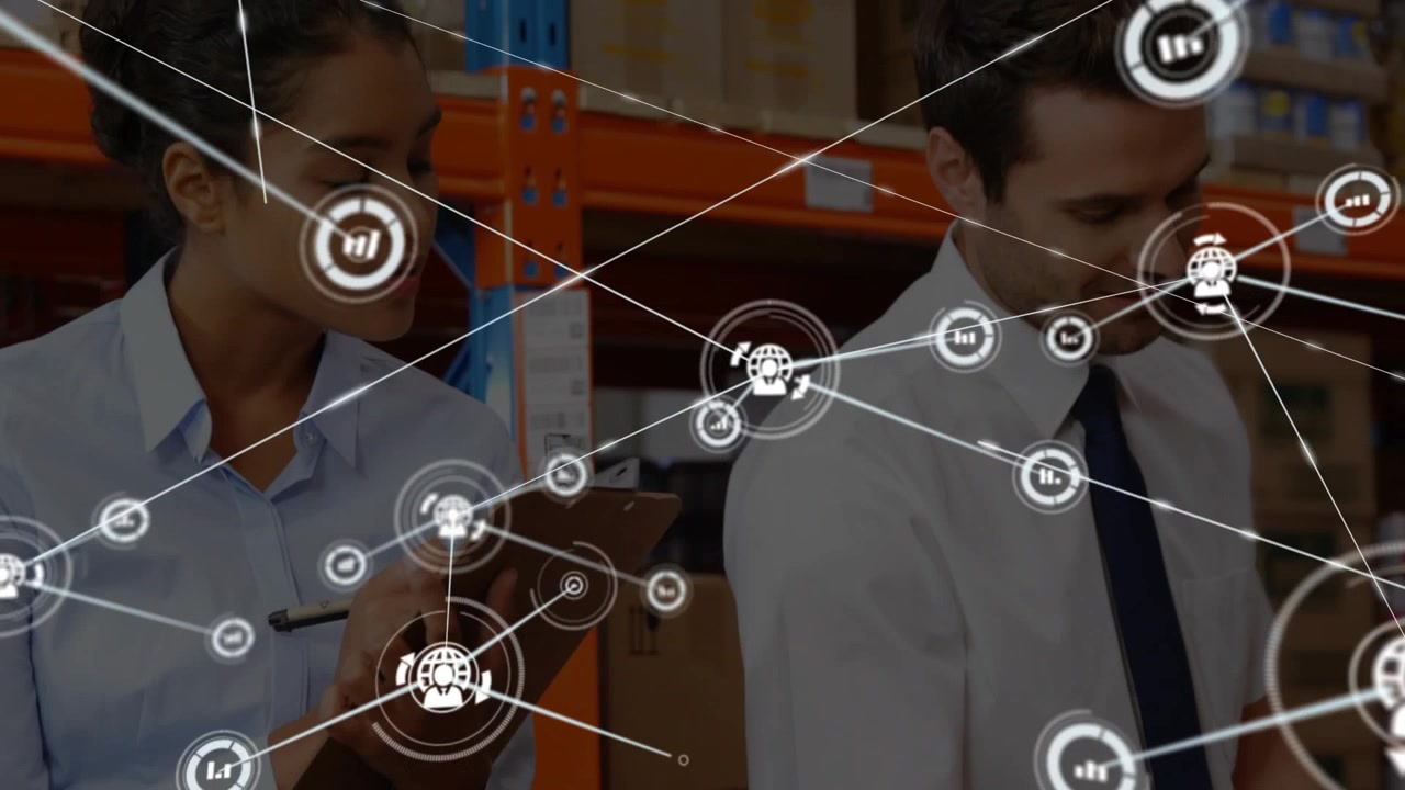 Two staff standing in warehouse, woman scanning clipboard starting HUD expanding showing stock data