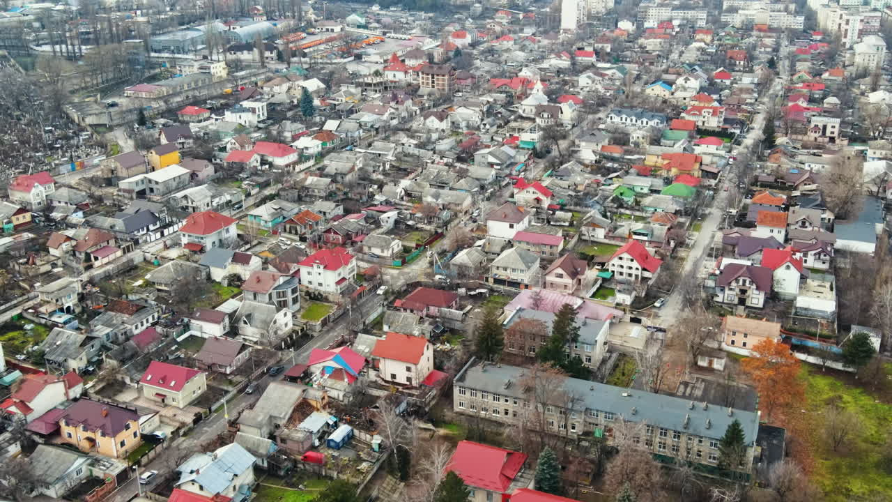 Aerial drone view of Chisinau. Panorama view of a residential district with multiple buildings, roads and bare trees. Good weather. Moldova
