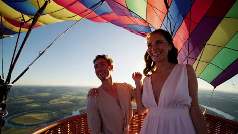 couple enjoying a romantic hot air balloon ride at sunrise