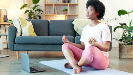 young black woman meditating on a webinar