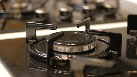 close-up of a modern black gas cooktop