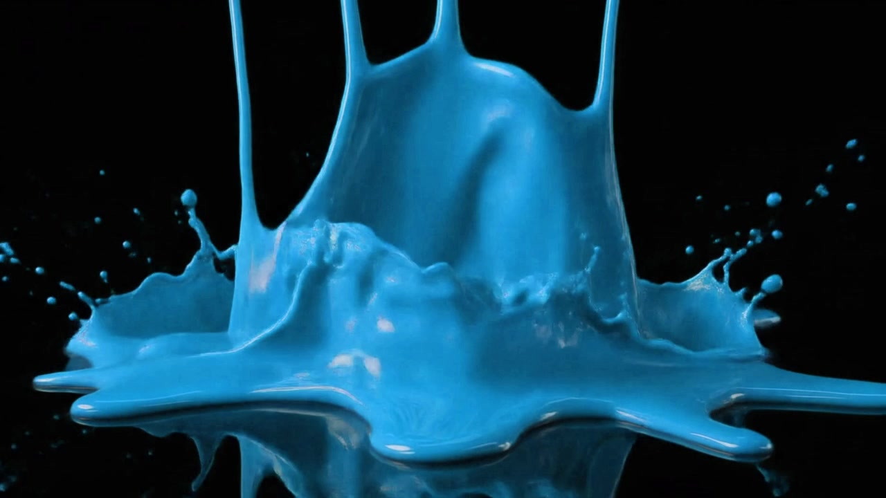 Bright Blue Paint Dripping and Splashing on Black Surface