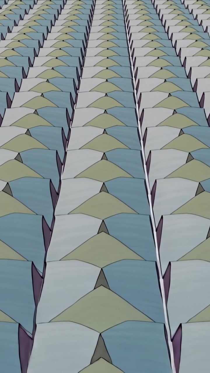 Vertical video: Panning camera revealing repeating triangular pattern on wall to show center seam