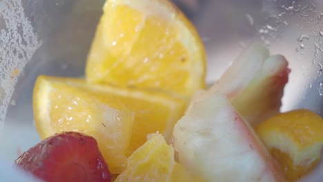 mixed fruit salad in a plastic cup