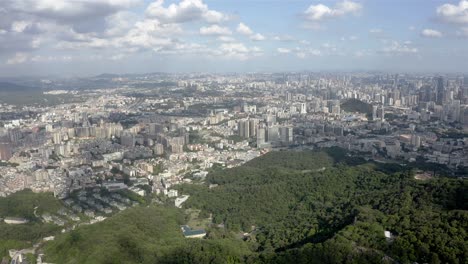 Chinese-city-of-Guangzhou,-4K-aerial-view-from-Baiyun-Mountain-of-urban-scene