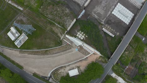 Aerial-top-down-view-of-Road-Construction-over-River-in-Tottori-Japan