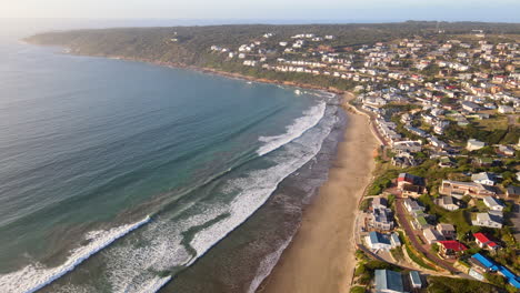 scenic stretch of white sand beach at holiday town of vleesbaai, high aerial