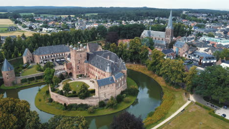 kasteel huis bergh, netherlands: aerial view traveling in to the beautiful castle and appreciating the moat and the nearby church