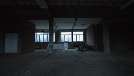 white square pieces of construction materials placed under the window of an unfinished premise. some debris are left in a pile in the corner. construction or reconstruction concept.