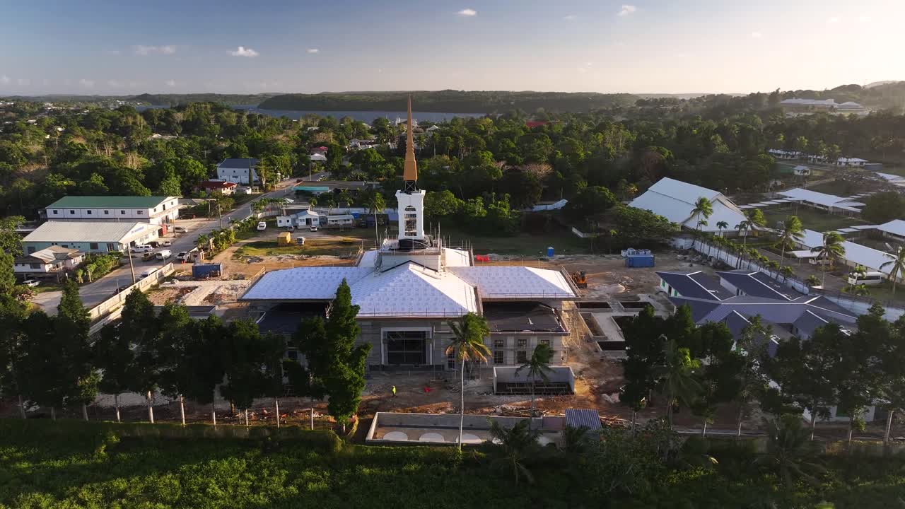 Neiafu Tonga Temple under construction in Vava'u Island. Drone reveal coastal scenery, Pacific Island.