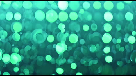 animación de manchas verdes que se mueven sobre un fondo negro