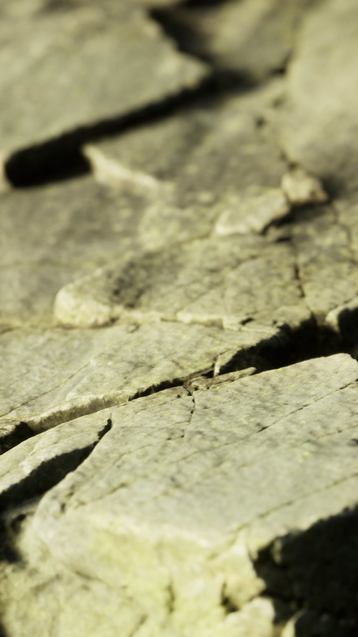 Close up of ancient rocks showing textures and natural patterns in sunlight
