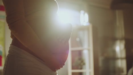 pregnant woman feeling her baby