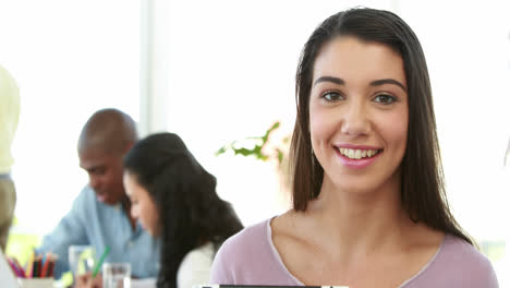 Casual-worker-using-tablet-pc-at-meeting