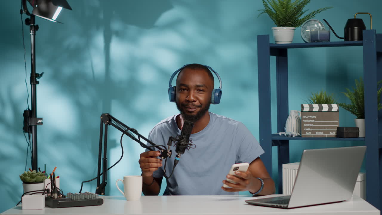 African american blogger recording video on camera for channel