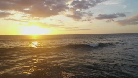 Drone-footage-of-waves-at-sunset