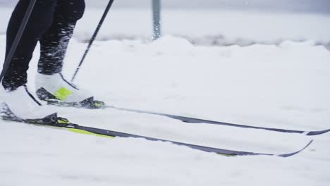 Slow-motion-close-up-shot-of-skiiers-boots-and-skiis