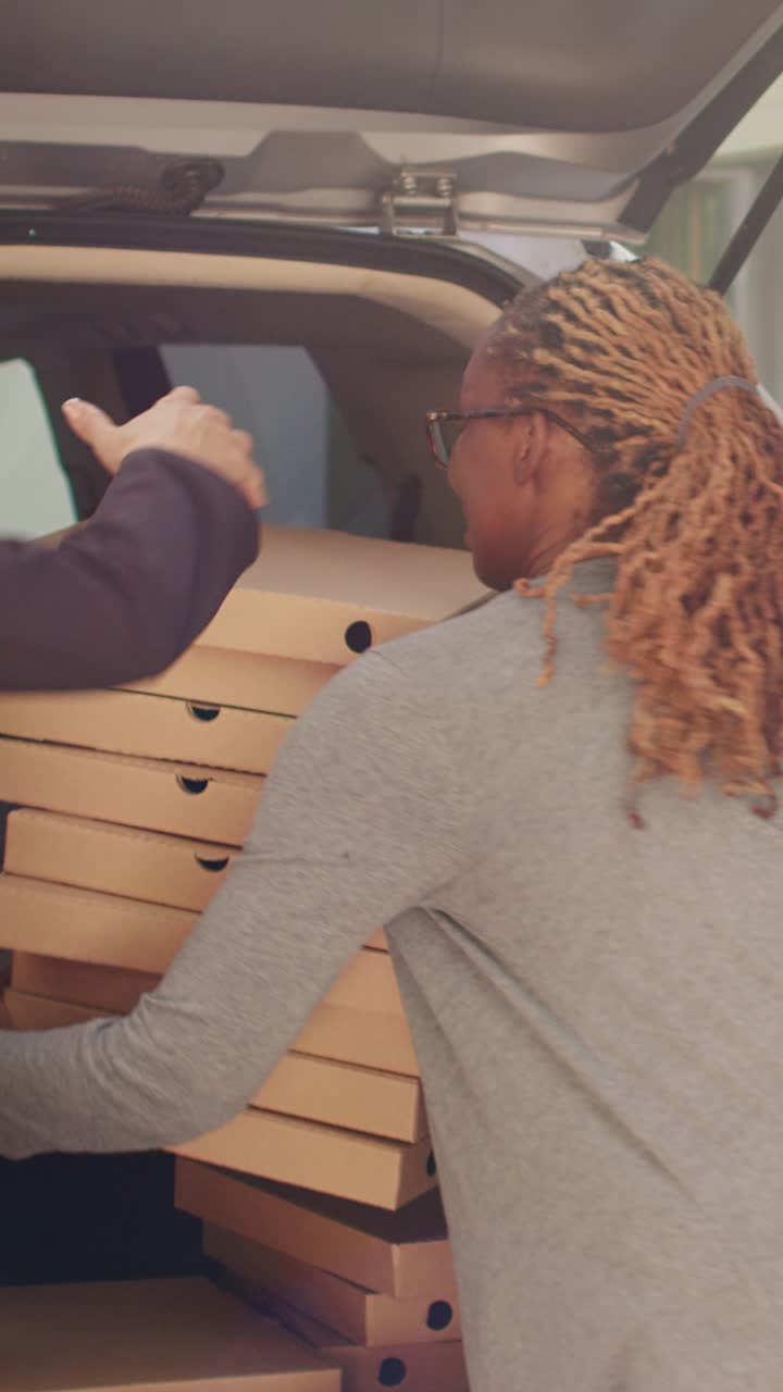 People delivering pizza with a car