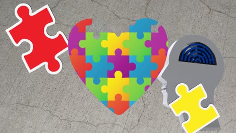 animación de rompecabezas cayendo sobre el corazón formado con rompecabeos y cabeza humana con laberinto