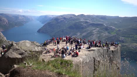 NORWAY--June-15,-2019:-Preikestolen-or-Prekestolen,-also-known-by-the-English-translations-of-Preacher's-Pulpit-or-Pulpit-Rock,-is-a-famous-tourist-attraction-in-Forsand,-Ryfylke,-Norway