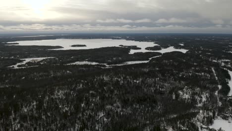 aerial shot of west hawk lake, manitoba in winter time